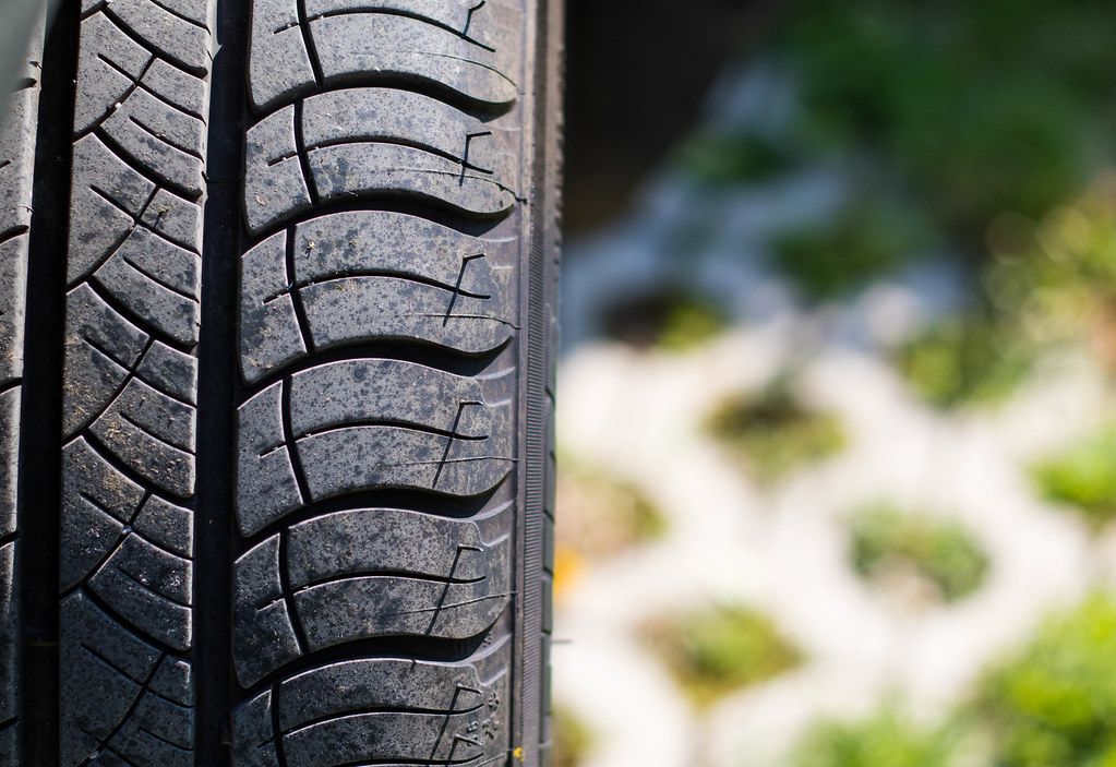 car-tire-close-up Car dealership showroom